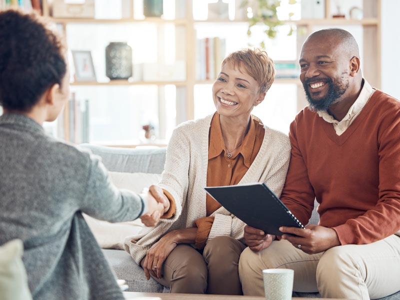 middle aged couple talking to probate consultant